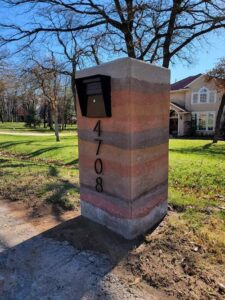 A rammed earth mailbox completed project